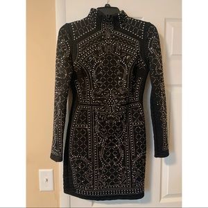 Long sleeve black dress.